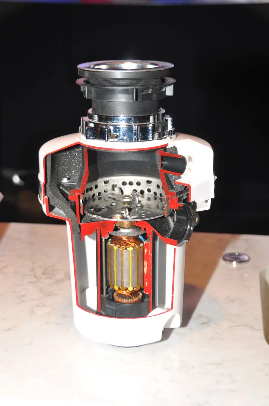 Cutaway view of a garbage disposal showing internal