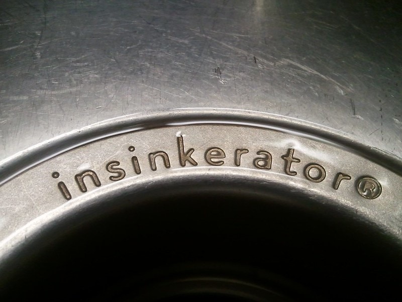 InSinkErator brand metal sink flange