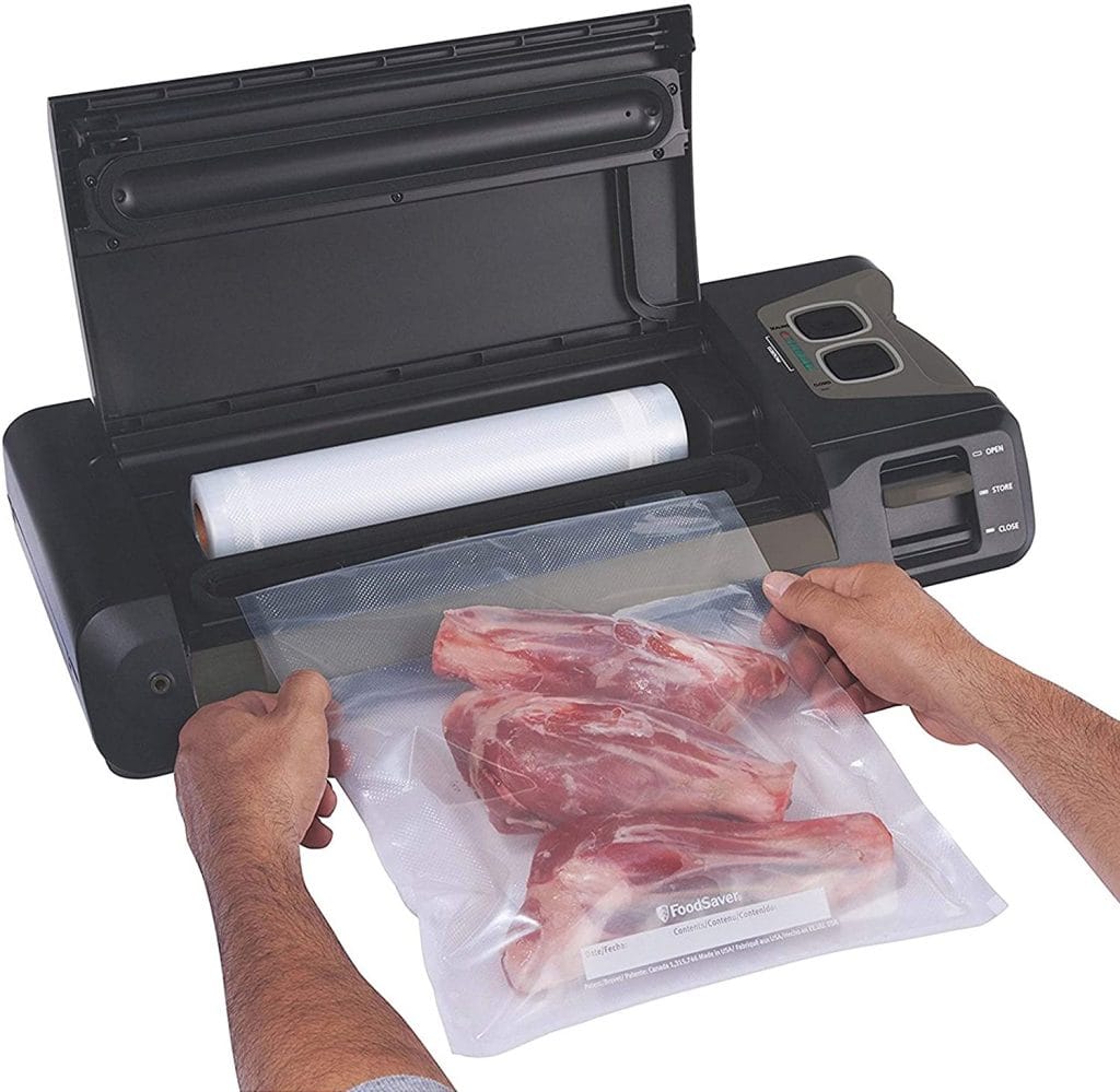 Vacuum sealer with built in bag storage and cutter